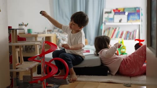 Children Playing with Toys in Bedroom