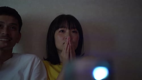 Couple Watches a Movie Together at Home