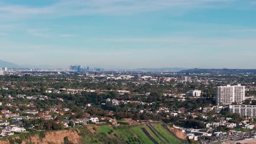 drone shot of santa monica, California with los angeles in the distance