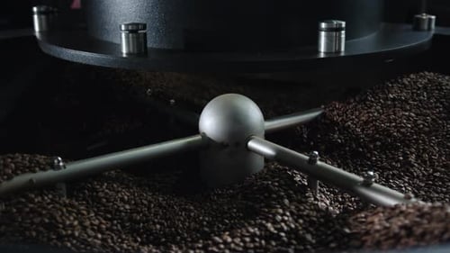 Coffee Beans Roasting in Industrial Machine Close Up