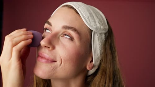 Close Up Studio Decorate Pink Background Beautiful Girl in Underwear Stands with Purple Sponge Near