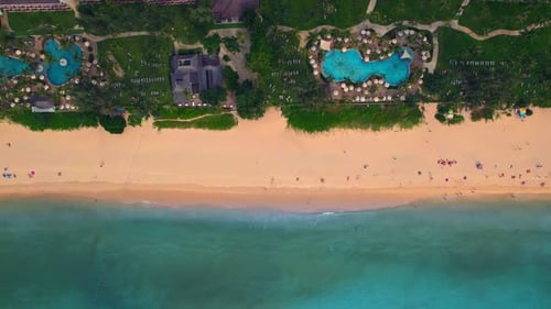 An Aerial View of a Beach with a Large Pool in the Middle of It