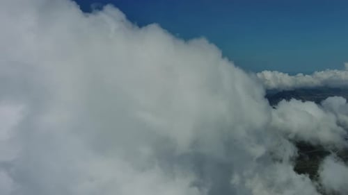 Aerial View of Majestic Clouds and Blue Sky