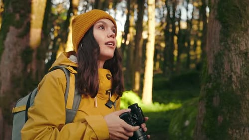 Forest Explorer Young Woman Capturing Nature with Camera