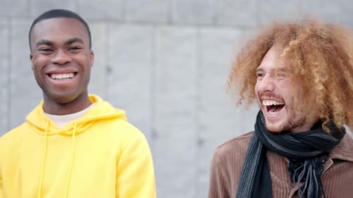 Happy Friends Laughing Standing in the Street