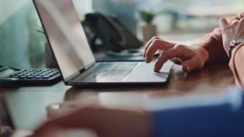 Two Professionals Hands Typing on Laptops at Office Closeup Unknown Managers