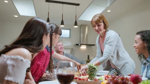 Family Members Enjoying Celebratory Meal Together