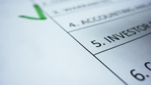 Closeup Green Maker Drawing Check Sign in Document. Checklist Document of Finished