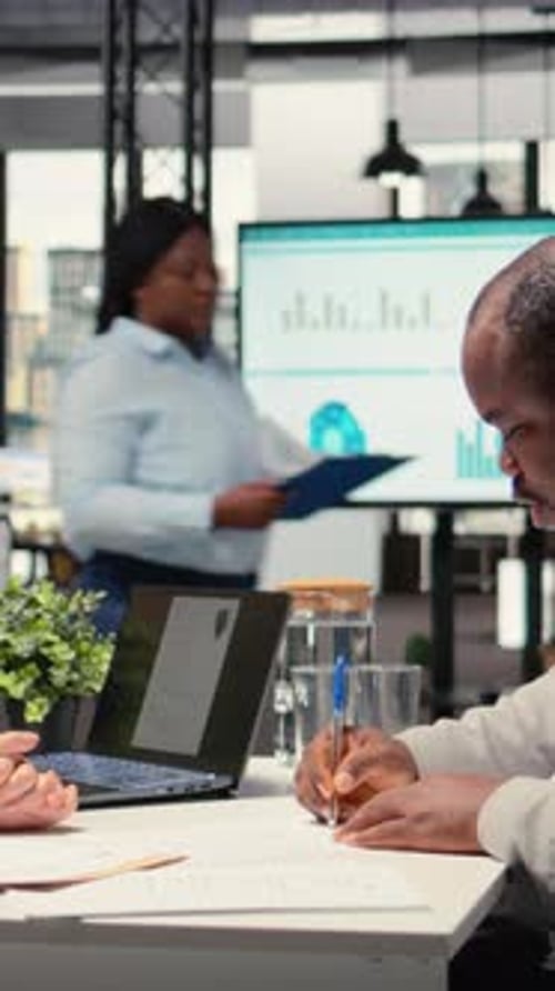 Business Meeting with Paperwork in an Urban Office