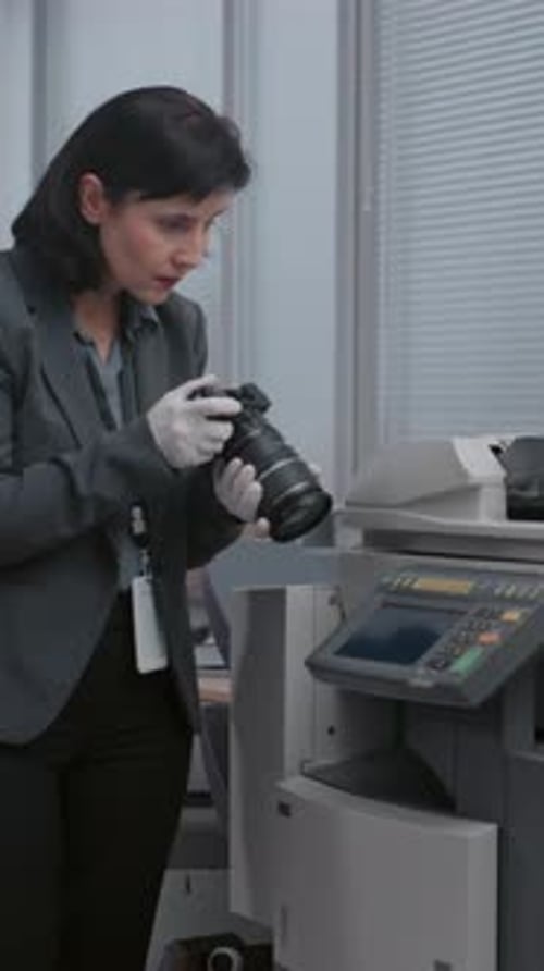 Woman in Gloves Taking Photos of Copier