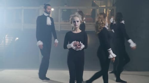 Performers Acting on a Foggy Stage