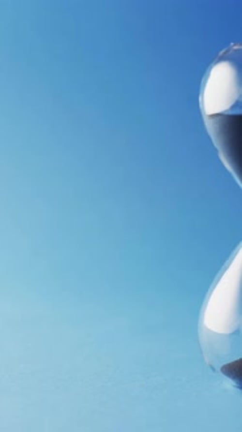 Hourglass with Black Sand Counting Down Time