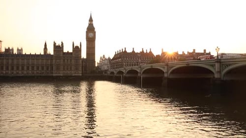 Westminster bridge and Big Ben in London at sunset in a very calm and warm scene