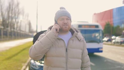 Man On Phone With Broken Down Car
