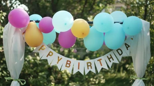 Colorful Birthday Archway with Balloons and Banner
