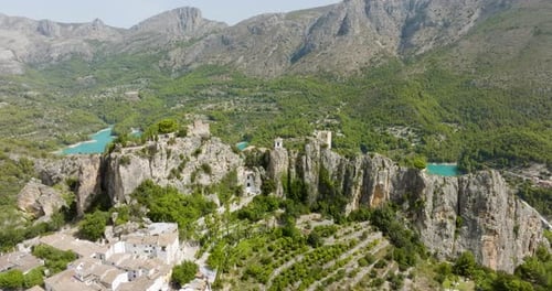 Guadalest Spain Town Rising Aerial Drone Shot Revealing Beautiful Mountain Lake And Forest