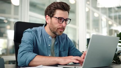 Man working tired at desk with Laptop in Office