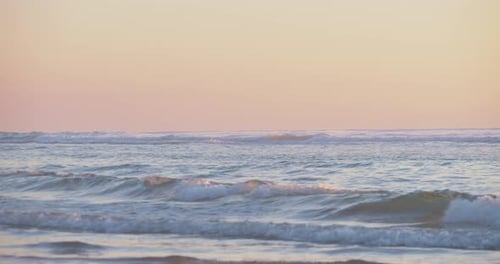 pastel colors sunset on the beach. clear gradient sky over the horizon and ocean pink and yellow