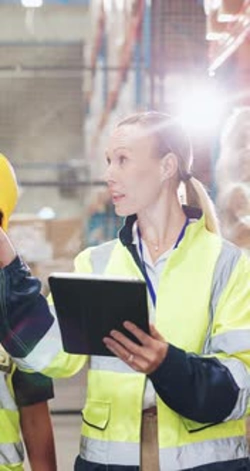 Warehouse worker, team and woman with tablet for logistics, inventory and discussion