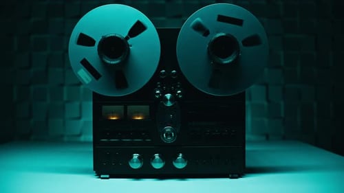 Hand Starting Recording Reel Tape Device in Dark Studio Closeup Retro Recorder
