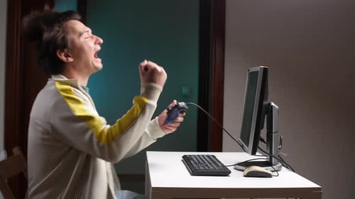 Young Adult Playing Video Game with Controller