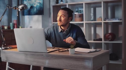 Dedicated and Focused Professional Engaged in a Modern and Stylish Home Office Setting