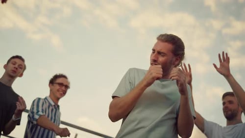 Bottom View Happy Man Performing Street Dance at Sunset Open Air Party