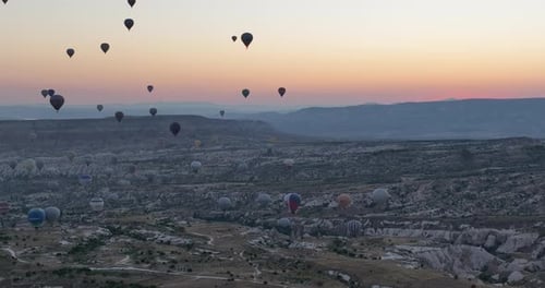 Aerial Cinematic Drone View of Colorful Hot Air Balloon Flying Over Cappadocia