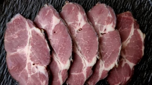 Meat, smoked ham, or pork sausage sliced for breakfast sandwiches. Sliced ham