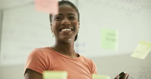 Smiling Woman Discussing Business Ideas Near Whiteboard