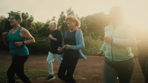 Group of diverse senior people jogging together at park
