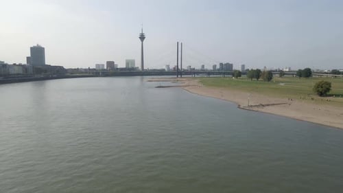 Aerial view of Rhine river with cargo boats cruising, Dusseldorf, Germany