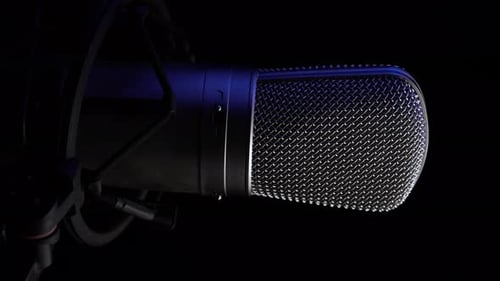 Vertical 4k Video, Professional Studio Microphone on Spinning Platform, Black Background