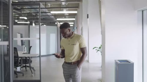 Portrait Young Businessman Texting with Smart Phone in Office Corridor Adult