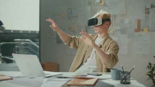 Concentrated Manager Wearing VR Headset During Work with New Project at Office