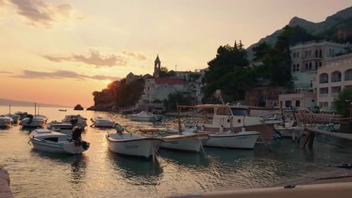 View of small port for boats and yahts in small sea city.