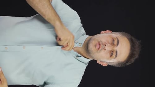 Man Unbuttons Shirt Because He Is Hot