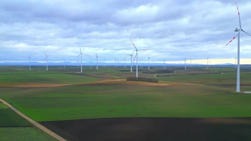Wind Turbines Generating Alternative Energy At The Wind Farm. wide aerial
