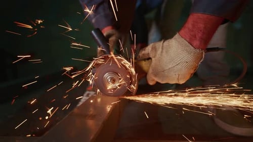 Craftsman Polishing Metal Meticulous Craftsman Using Angle Grinder to Polish Metal in Dim Workshop