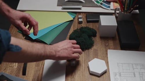 Design and Architecture Studio Closeup Male and Female Hands of Interior Designers Working with