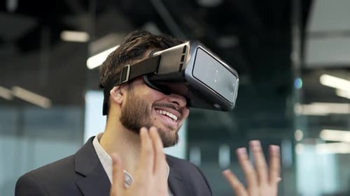 Man using VR headset in modern office setting