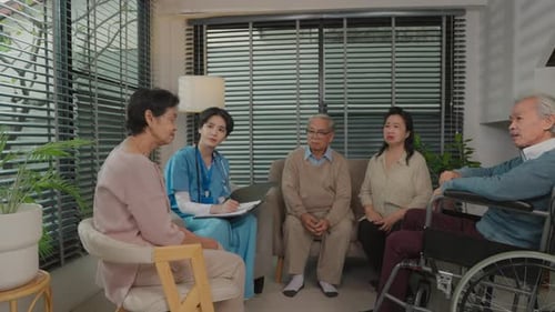 Medical Professional Consults with Senior Adults