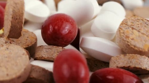 Falling tablets and pills. Medicine and healthy. Close up of capsules.