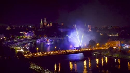 Fireworks over Wawel Royal Castle and Vistula river in Krakow during Dragon Parade, Poland.