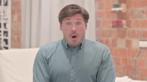 Man Reacts in Shock, Surprise, and Concern