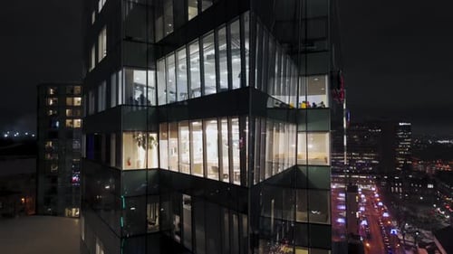 Cinematic Drone View Night Windows of the Skyscraper Office Corporate Building