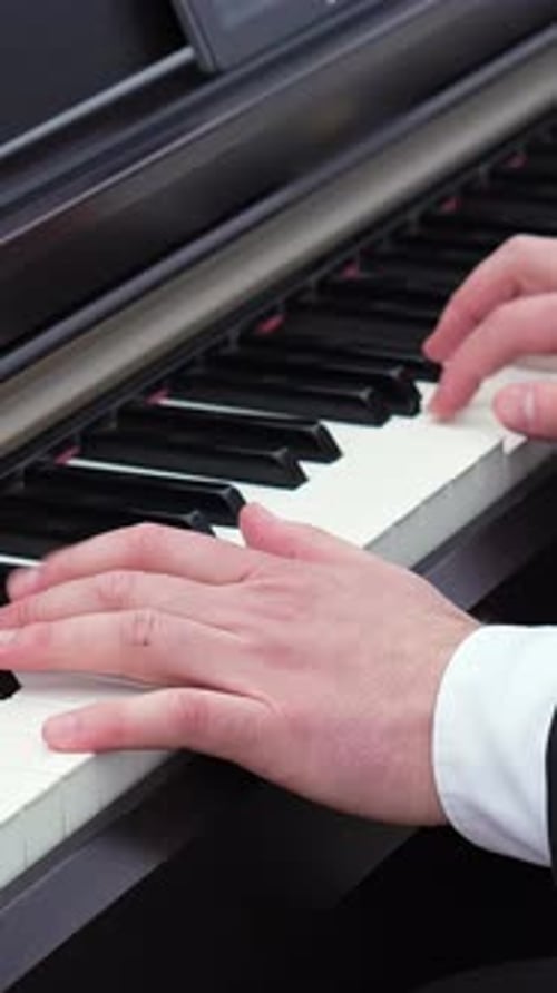 Hands Playing a Digital Piano Close Up