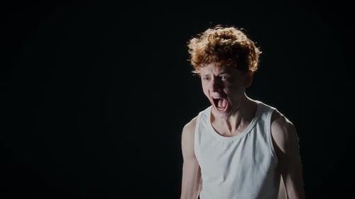 Young Man Screaming in Rage