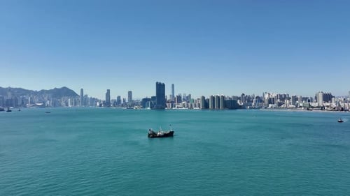 Hong Kong skyline view from cruise ship leaving port. Waterfront buildings and cityscape of modern C