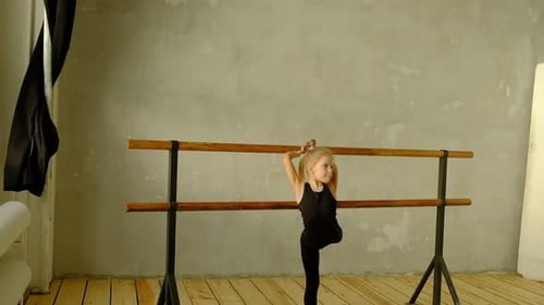 Slow Motion Teacher of Classical Dance Teaches Some Steps to His Young Student Who Wants to Learn